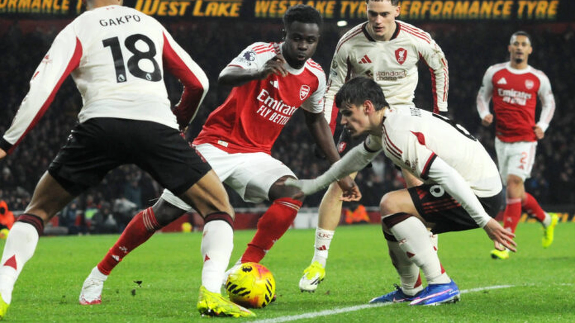 Arsenal and Liverpool players contest possession during a tense Premier League draw at the Emirates Stadium