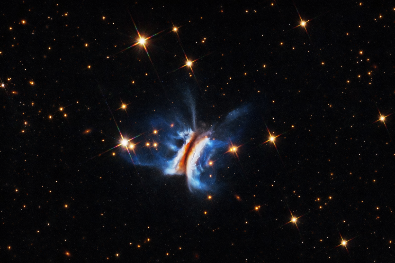 Hubble Reveals the Largest Planet Forming Disk Ever Seen