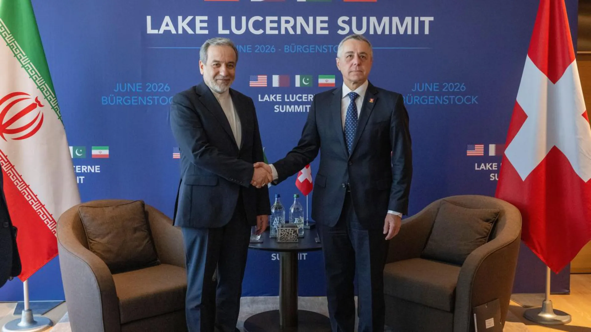 Iranian Foreign Minister Abbas Araghchi shakes hands with Switzerland's Foreign Minister Ignazio Cassis at the Burgenstock resort near Lucerne during U.S.-Iran peace talks on June 21, 2026.