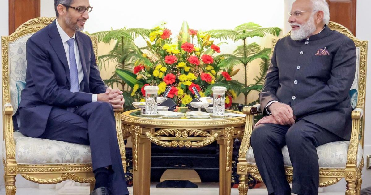 Prime Minister Narendra Modi meeting Google CEO Sundar Pichai at the India AI Impact Summit 2026 in New Delhi discussing AI collaboration and Indian talent development.