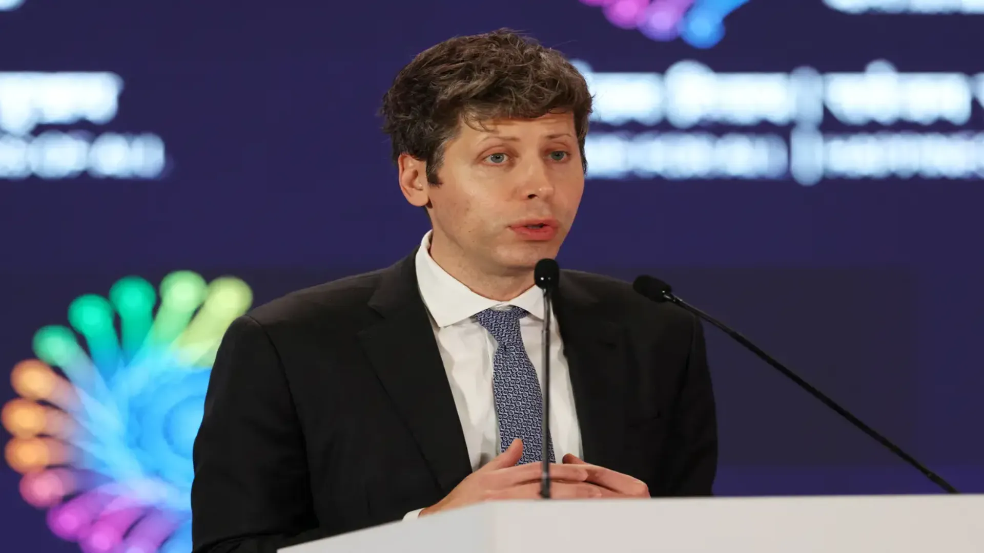 Sam Altman discussing the impact of artificial intelligence on jobs and the future of work during a public conversation