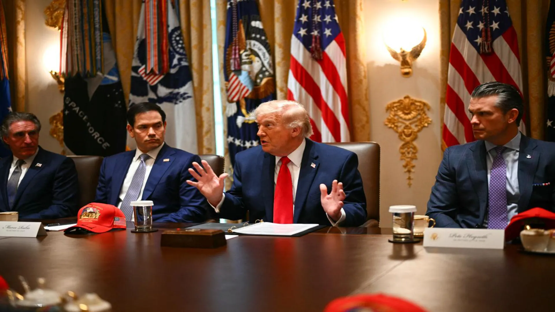 US President Donald Trump speaking at a White House cabinet meeting warning Oman against controlling the Strait of Hormuz amid ongoing Iran-US nuclear negotiations in 2026.
